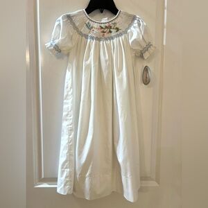 White Smocked Girls' Dress with Blue Trim and Floral Embroidery